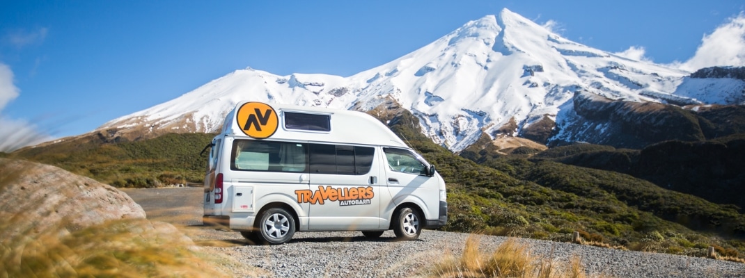 Campervan parked at the bottom of a mountain in New Zealand