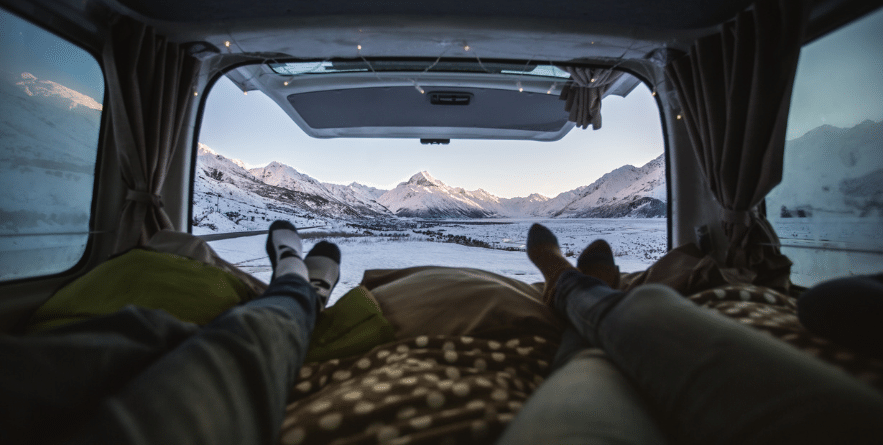 View of mountains out the back of a campervan in New Zealand