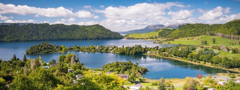 10 min drive from Rotorua, alongside the clear waters of The Blue Lake (Lake Tikitapu) and surrounded by native bush. 