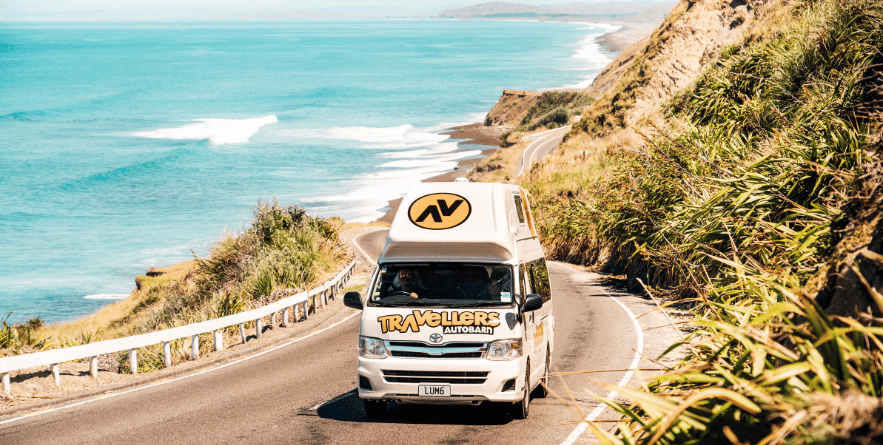 Campervan driving along New Zealand coastline