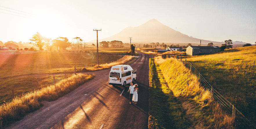 Campervan on road in New Zealand during Golden Hour