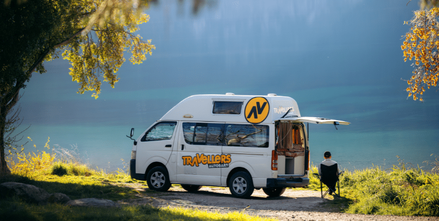Campervan parked next to lake in New Zealand